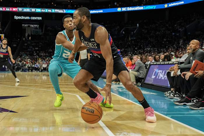 Oct 27, 2023; Charlotte, North Carolina, USA; Detroit Pistons guard Alec Burks (14) dribbles past Charlotte Hornets forward Brandon Miller (24) during the second half at Spectrum Center.